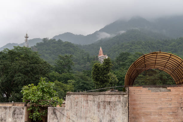 Foggy Mountain Viw with Green Trees and Temple in Rishikesh, India