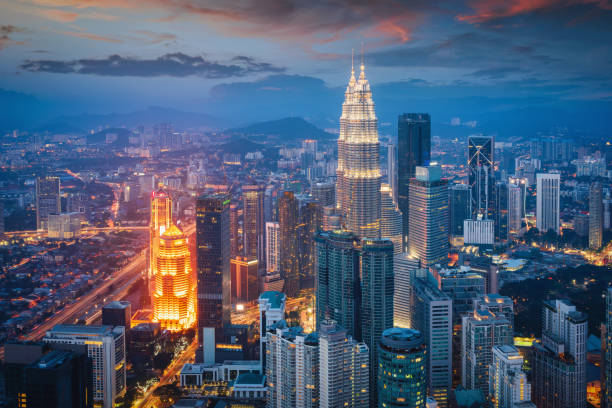 Kuala Lumpur Cityscape view towards the iconic Petronas Towers in downtown Kuala Lumpur during a colorful vibrant twilight after sunset. Kuala Lumpur, Malaysia, Asia