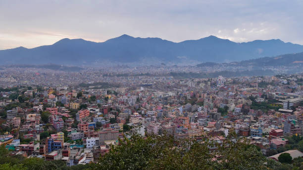 Panorama view over the west of densely populated Kathmandu, Nepal with Himalaya foothills (Chandragiri Hills) in background viewed from historic Buddhist temple complex Swayambhunath.