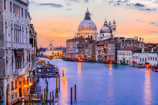 Venice, Italy. Gorgeous view of the Grand Canal and Basilica Santa Maria della Salute during sunset with amazing clouds.