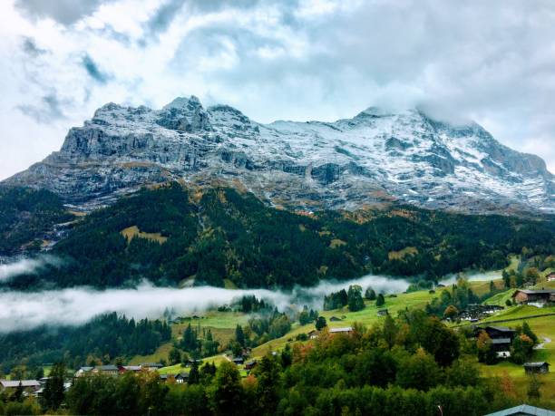 Grindelwald, Switzerland is a village that sits in a valley with the Swiss Alps surrounding it on all sides.