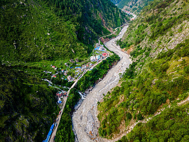 The aerial view shows the Rasuwagadhi flood destroying a Friendship bridge, road, a hydropower substation, and sweeping away vehicles in Rasuwa, Nepal.  Local roads between Syabrubesi and Rasuwagadhi, including the Pasang Lhamu Highway, are washed out in multiple locations.