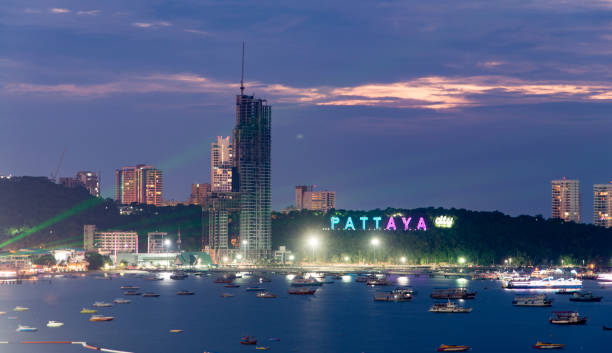 City and beach view of the city of Pattaya, Thailand, during a cloudy evening.